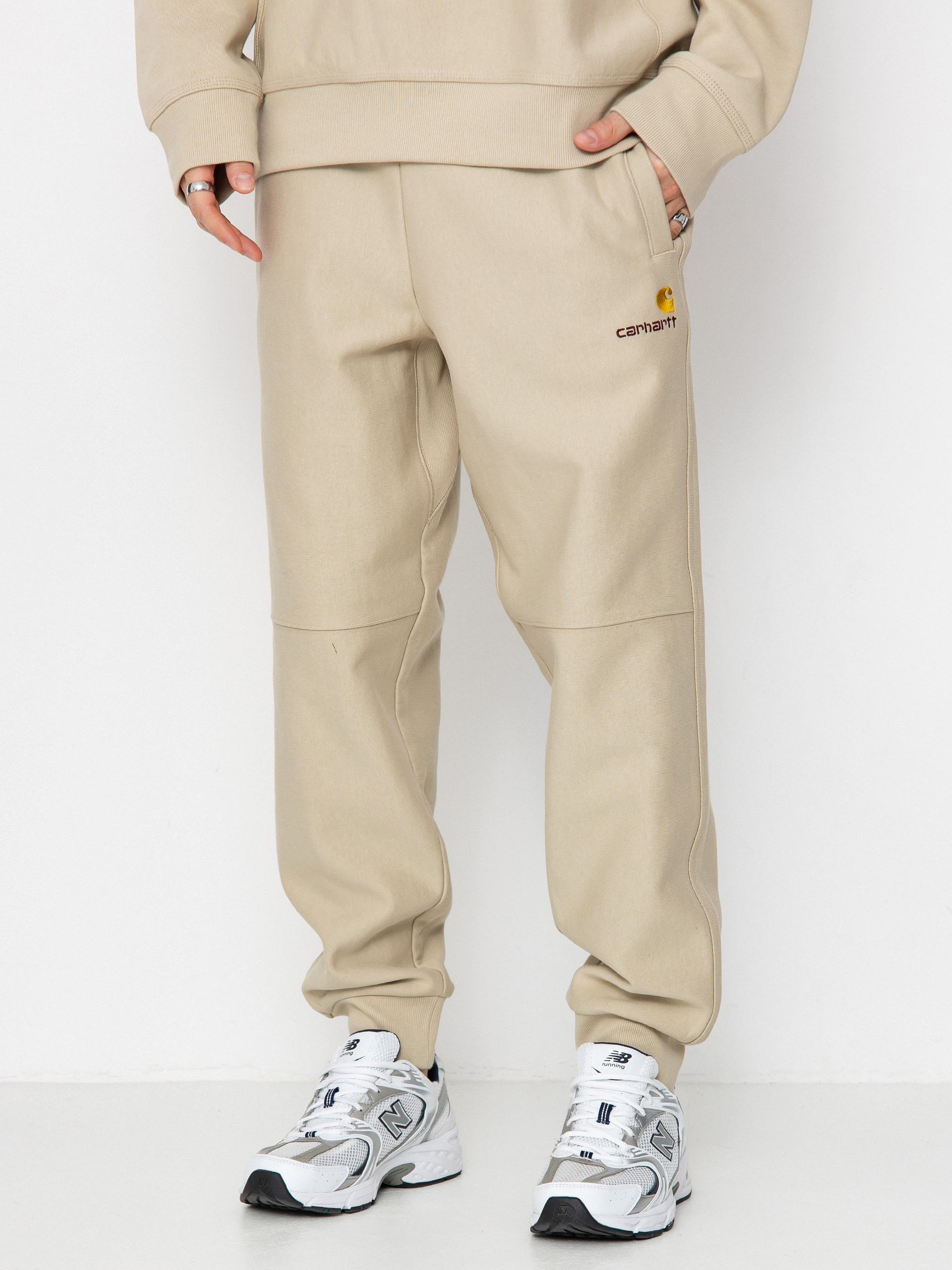 Штани Carhartt WIP American Script Jogging (fleur de sel)