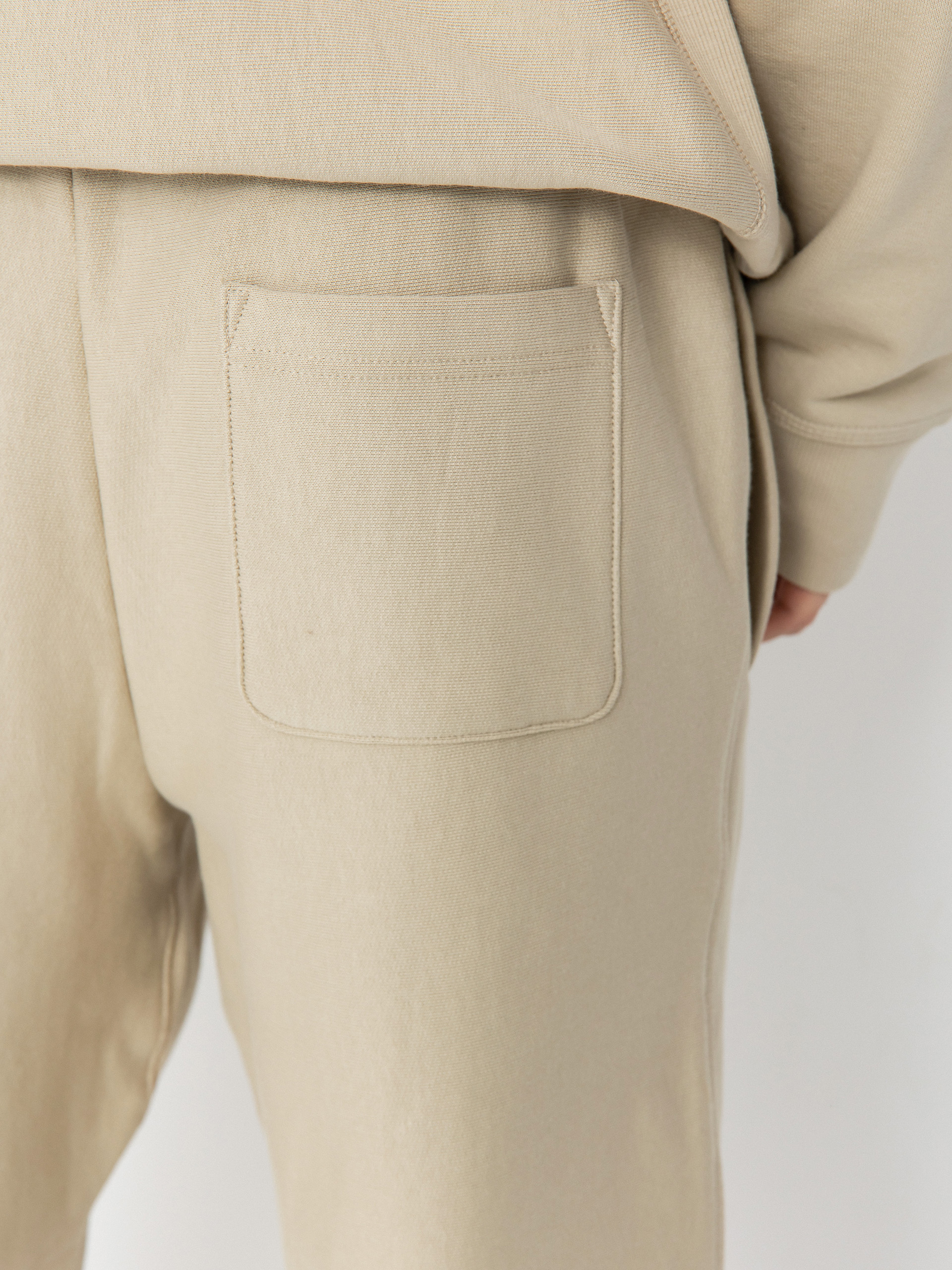 Штани Carhartt WIP American Script Jogging (fleur de sel)