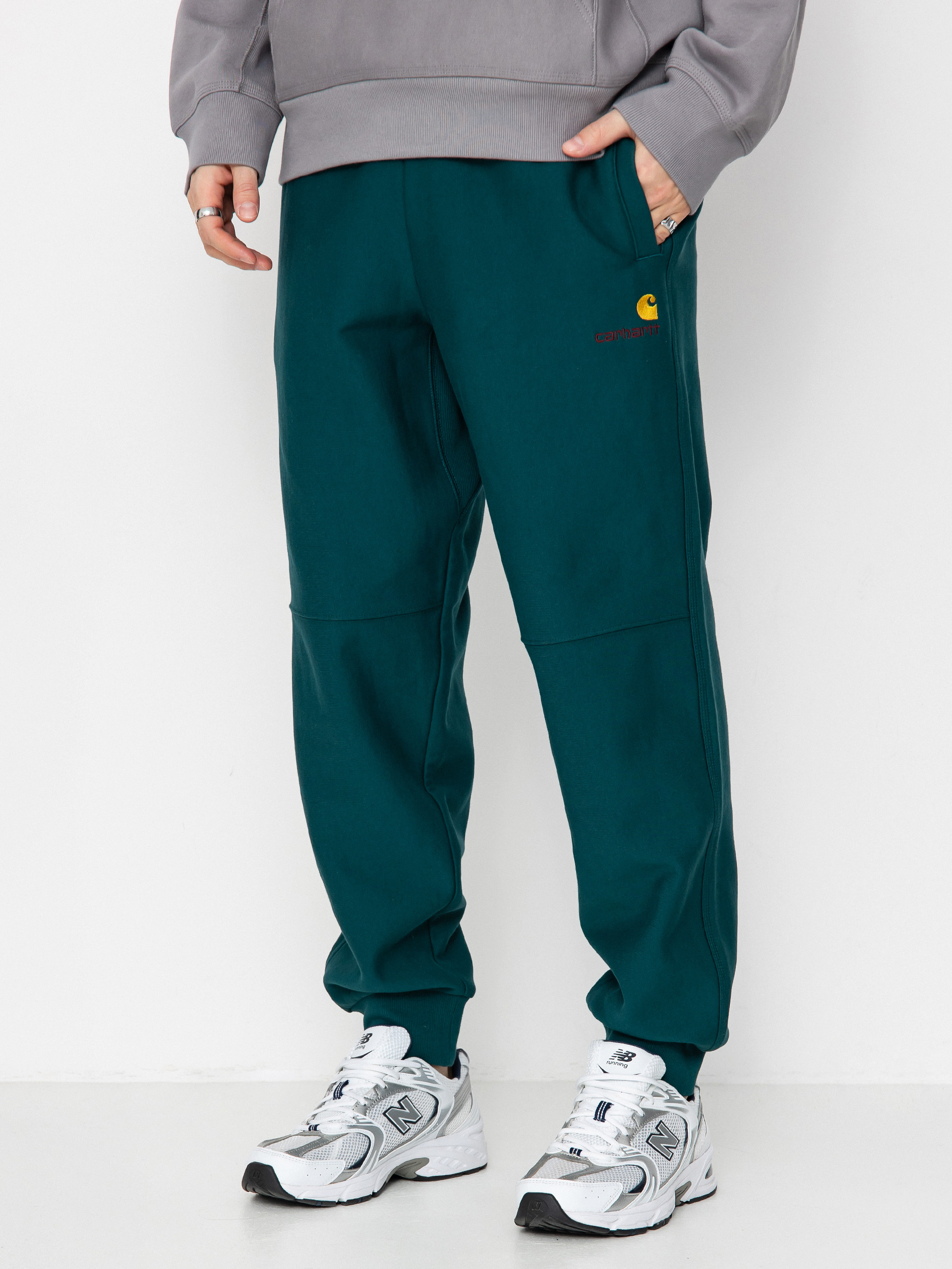 Штани Carhartt WIP American Script Jogging (malachite)