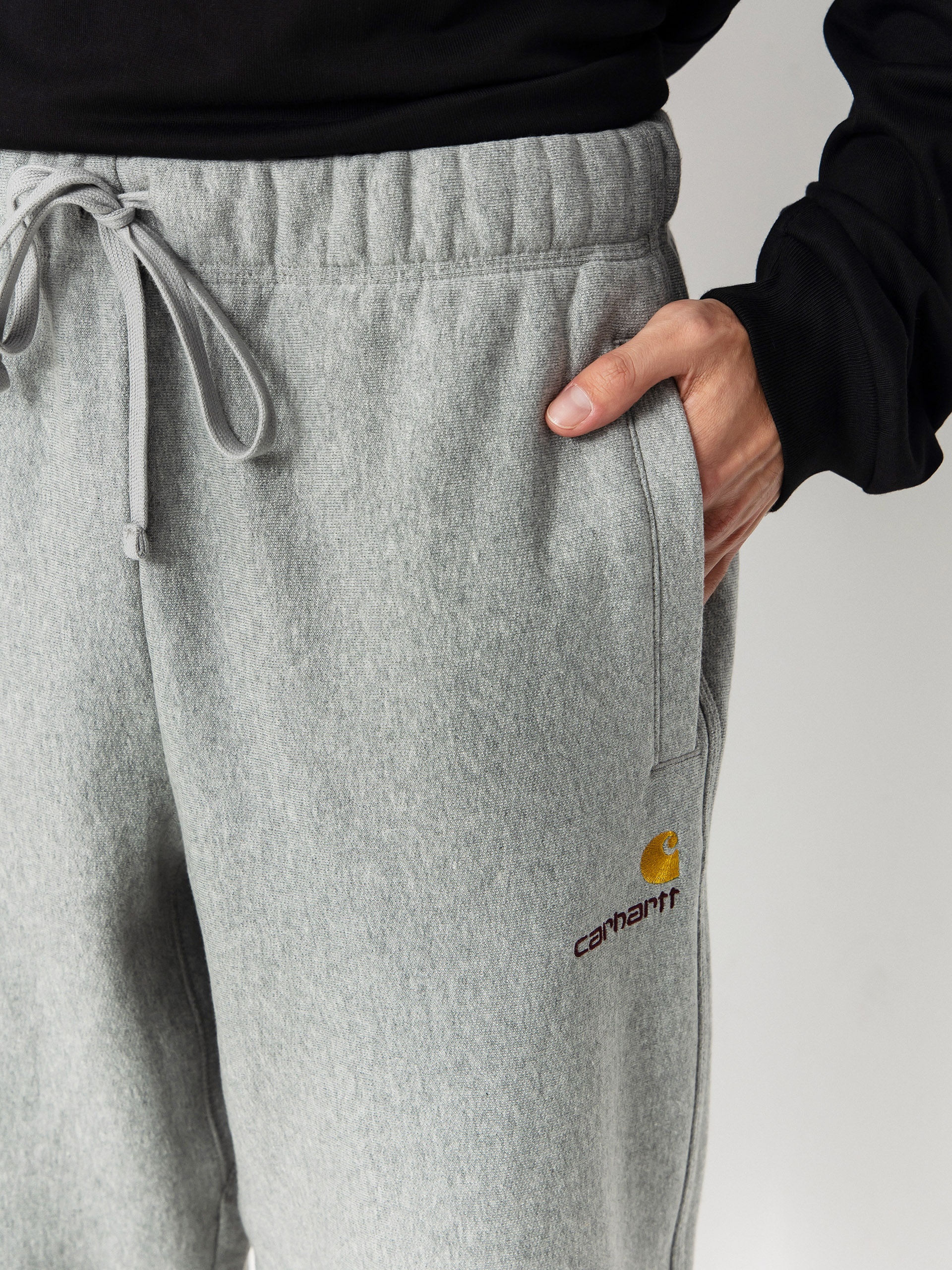 Штани Carhartt WIP American Script Jogging (grey heather)