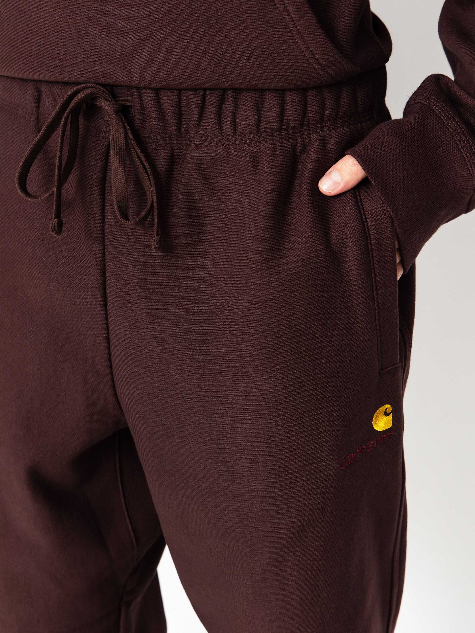 Штани Carhartt WIP American Script Jogging (palisander)